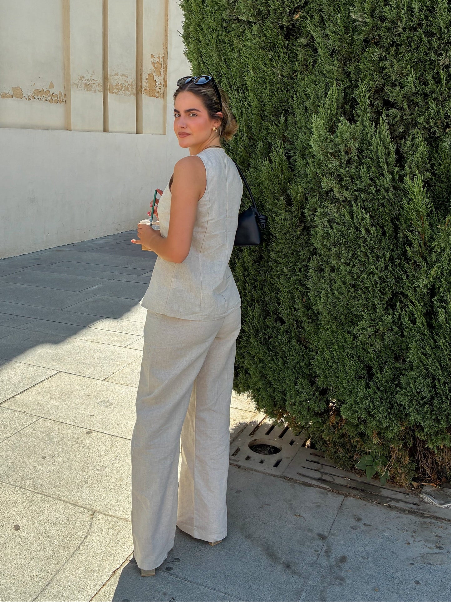 Side view of the Sienna trousers showcasing the wide-leg silhouette
