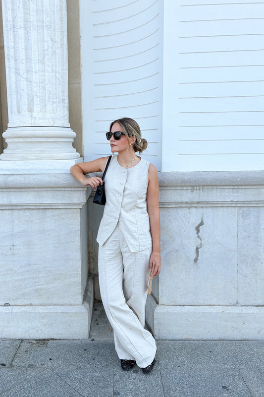 Front view of the Sienna high-waisted wide-leg trousers in beige linen blend